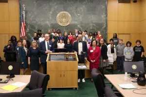 U.S. District Judge Michael J. Newman, U.S. Magistrate Judge Zia M. Faruqui and U.S. District Judge Angel Kelley are joined by other judges, attorney volunteers, and student participants following a civics program at the D.C. federal courthouse.